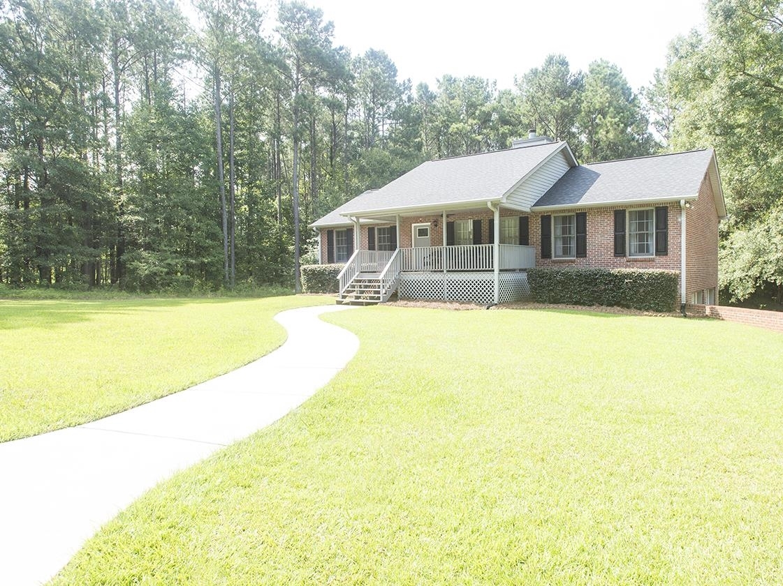 1757 Locust Grove Road Griffin, GA 30223 - Photo 1 of 1 a front view of a house with swimming pool
