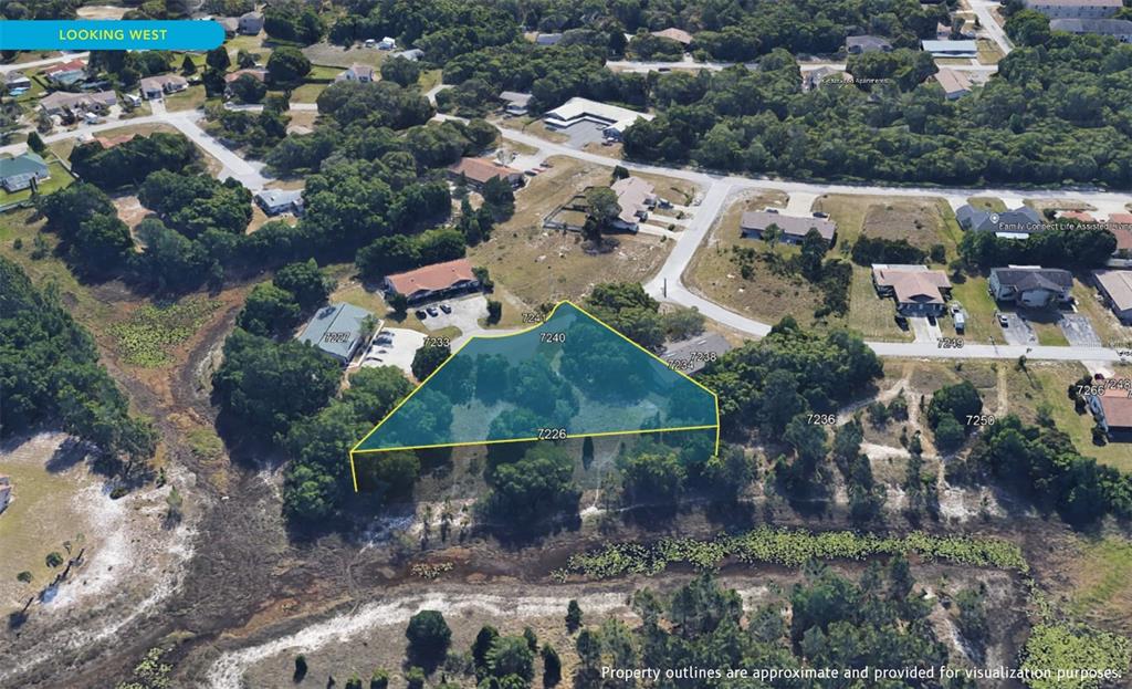 7226 Sky Court Spring Hill, FL 34606 - Photo 13 of 17 an aerial view of multiple house