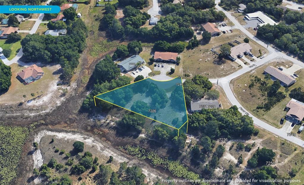 7226 Sky Court Spring Hill, FL 34606 - Photo 14 of 17 an aerial view of a house with a yard