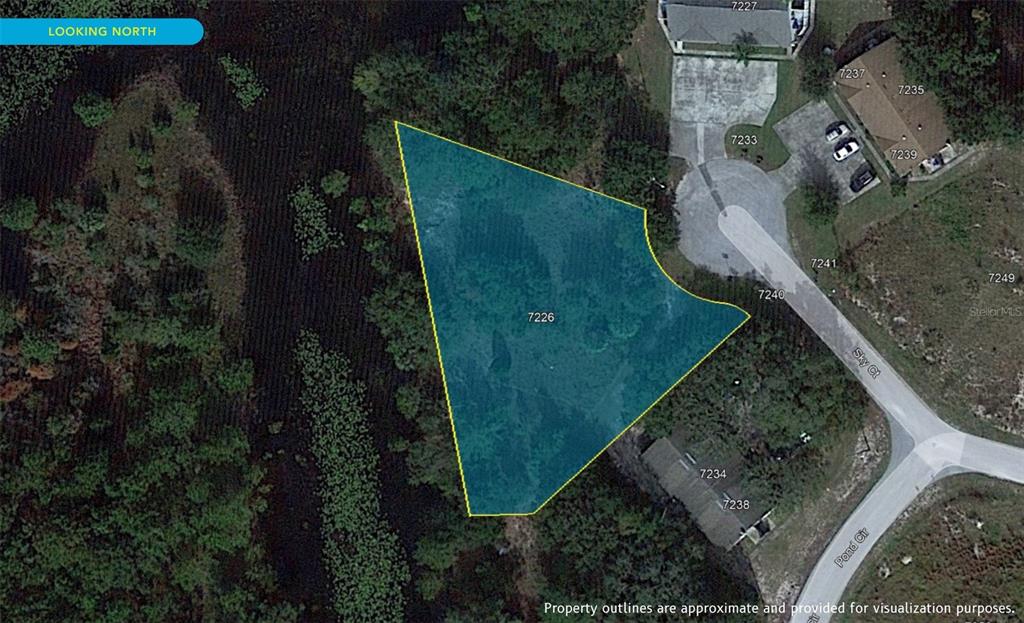 7226 Sky Court Spring Hill, FL 34606 - Photo 2 of 17 an aerial view of a house