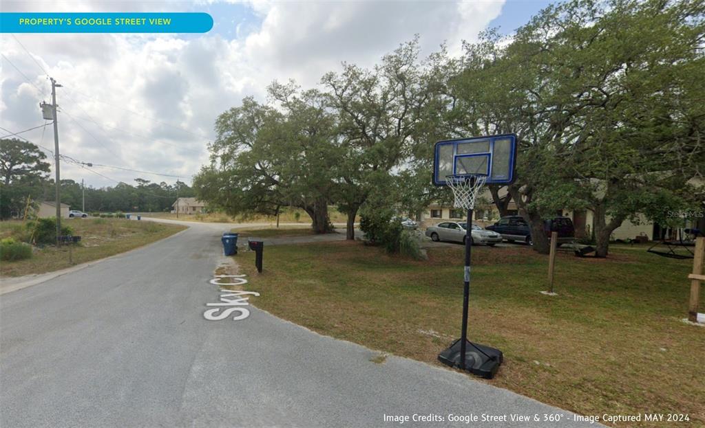 7226 Sky Court Spring Hill, FL 34606 - Photo 5 of 17 a view of a street with a building in the background