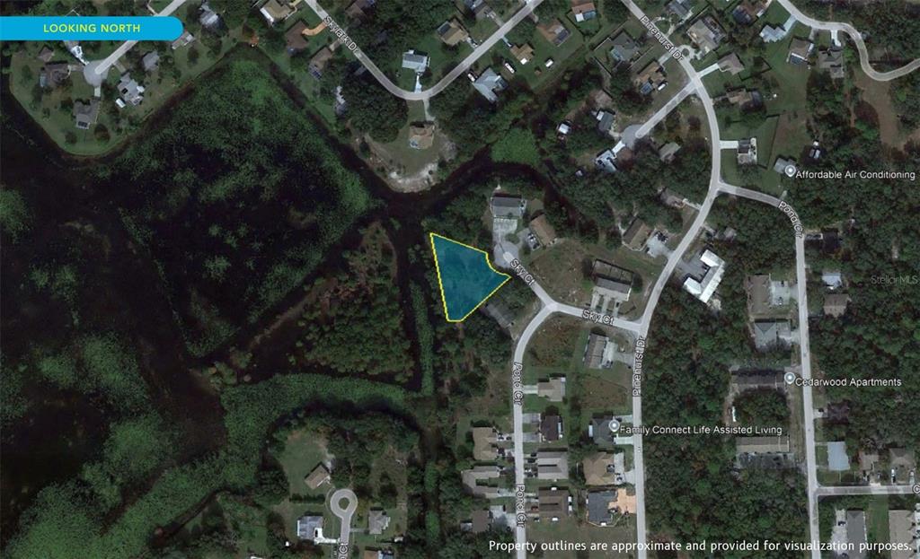 7226 Sky Court Spring Hill, FL 34606 - Photo 7 of 17 an aerial view of a house