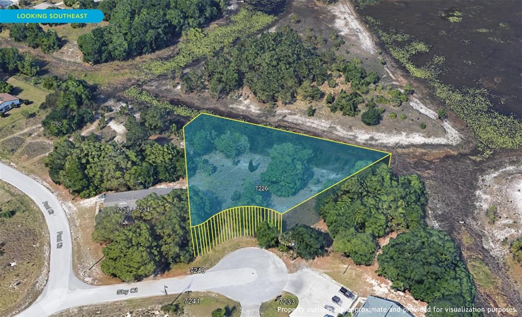 7226 Sky Court Spring Hill, FL 34606 - Photo 10 of 17 an aerial view of a house having yard