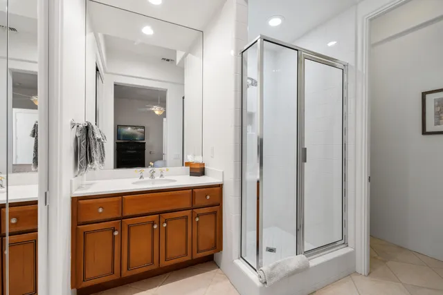a bathroom with a double vanity sink and mirror