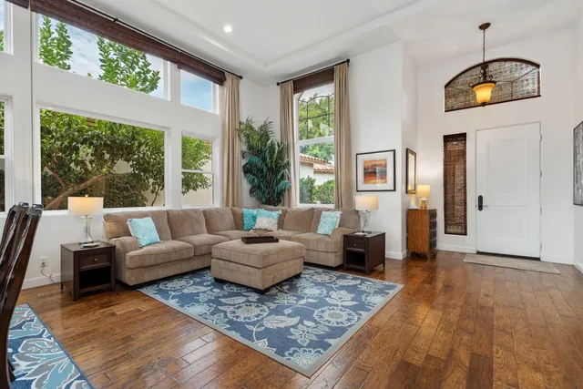 a living room with furniture and a large window