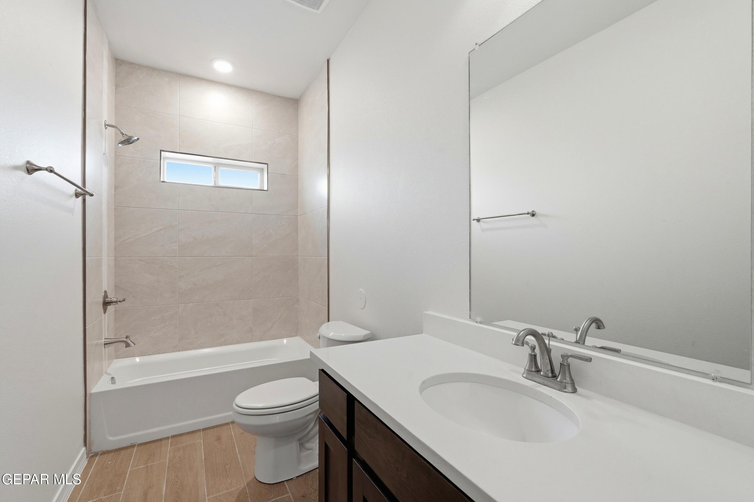 3764 Model Lane El Paso, TX 79938 - Photo 11 of 20 a bathroom with a sink toilet and shower