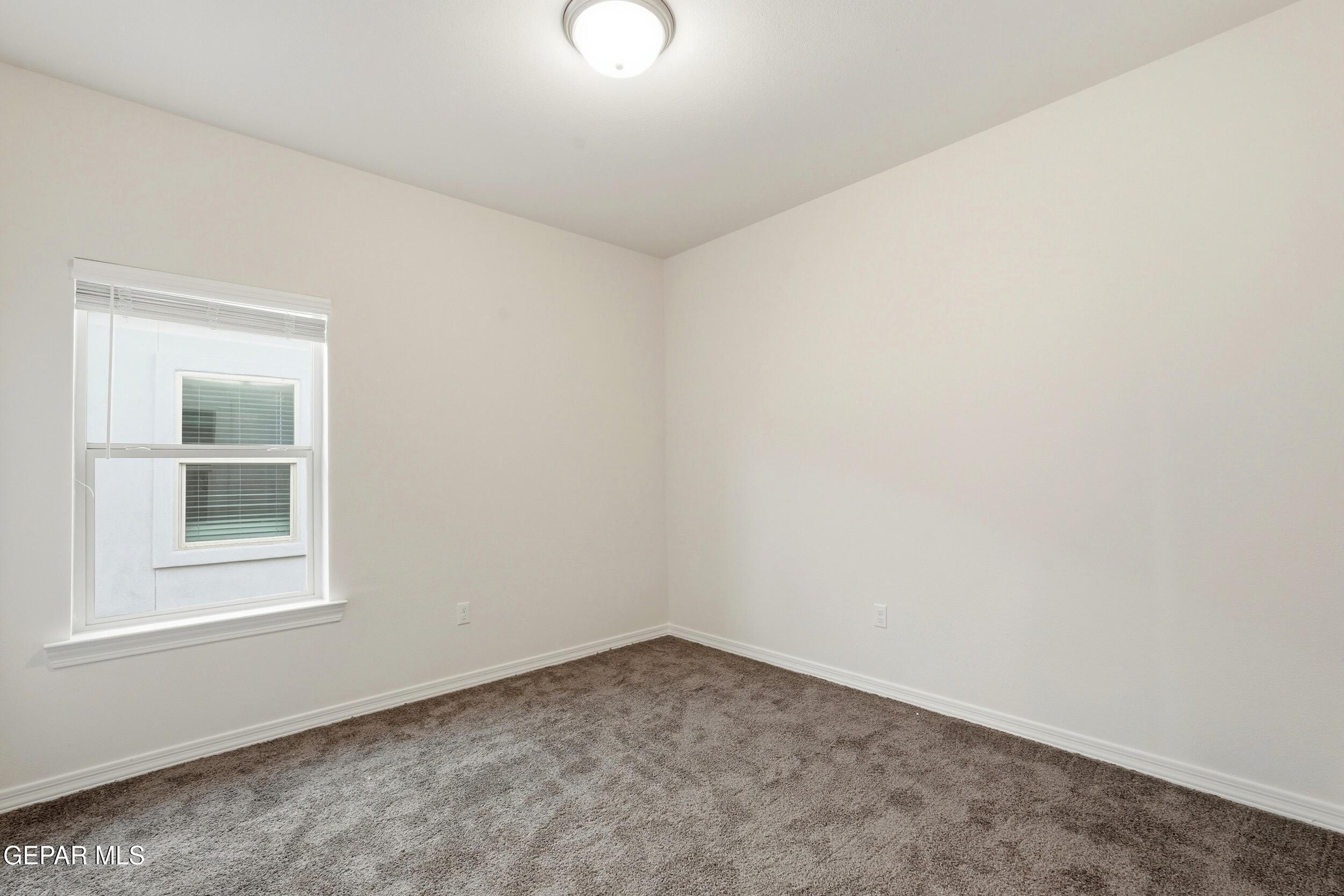 3764 Model Lane El Paso, TX 79938 - Photo 14 of 20 an empty room with a window