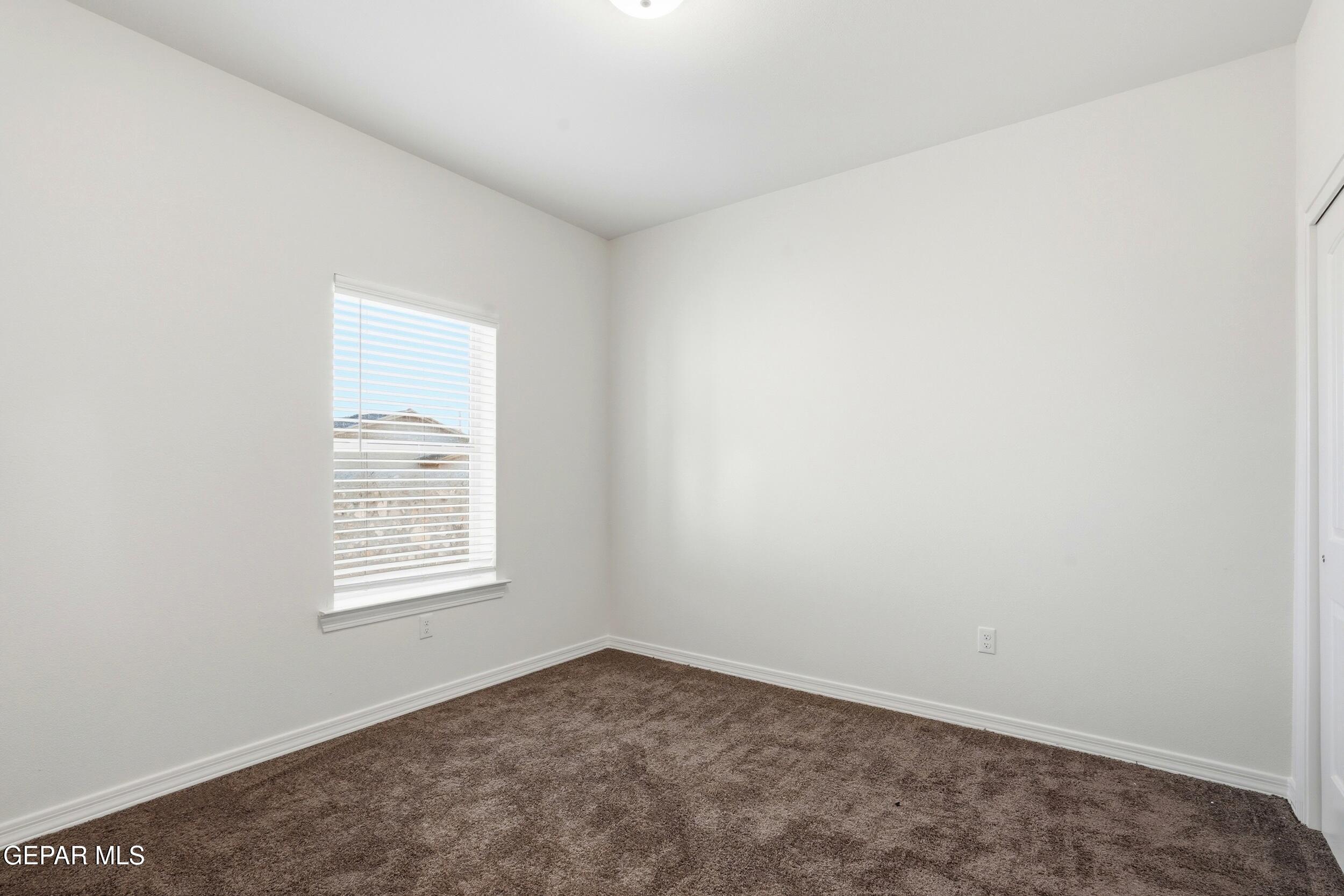 3764 Model Lane El Paso, TX 79938 - Photo 15 of 20 an empty room with a window