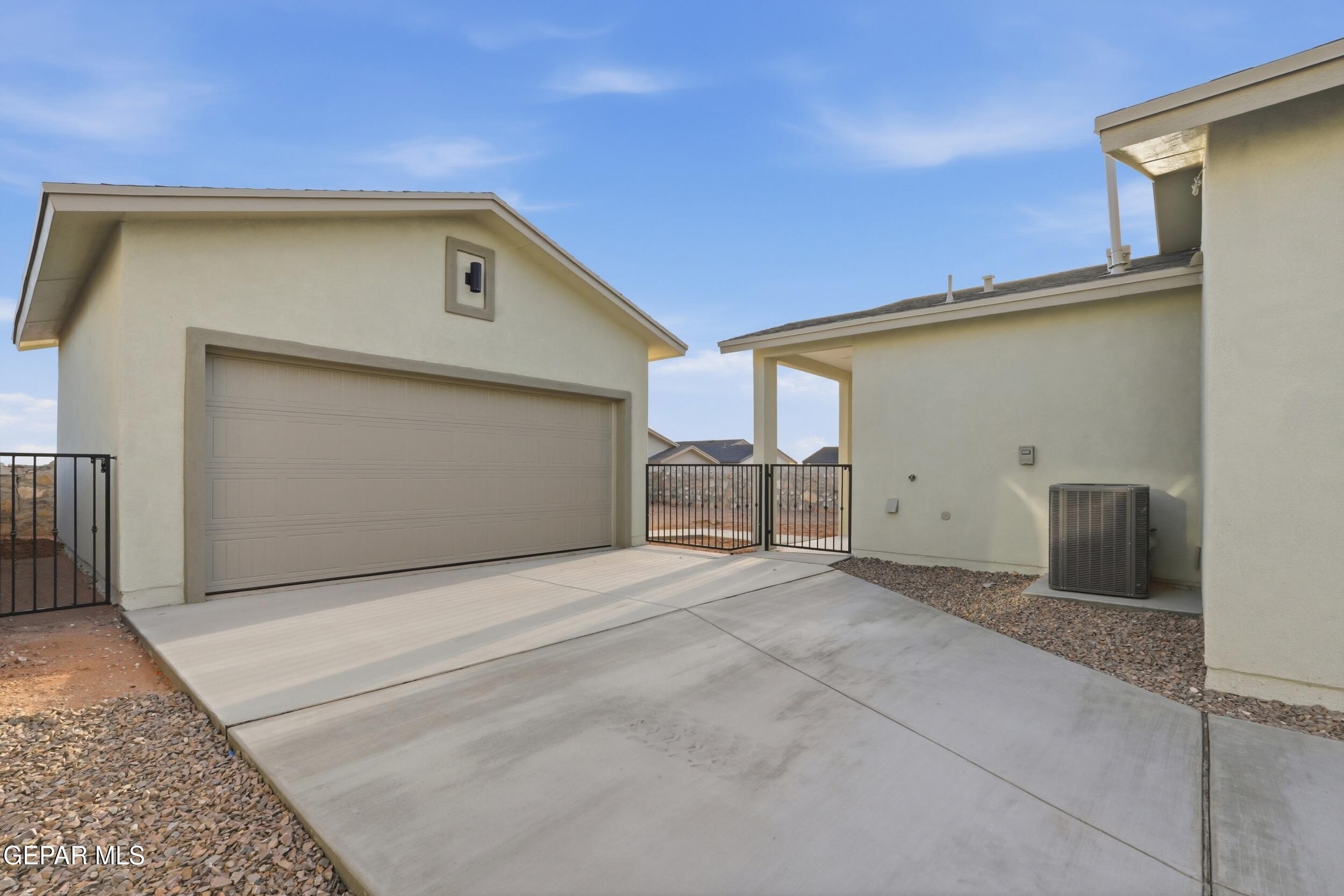 3764 Model Lane El Paso, TX 79938 - Photo 19 of 20 a view of an empty room with a garage