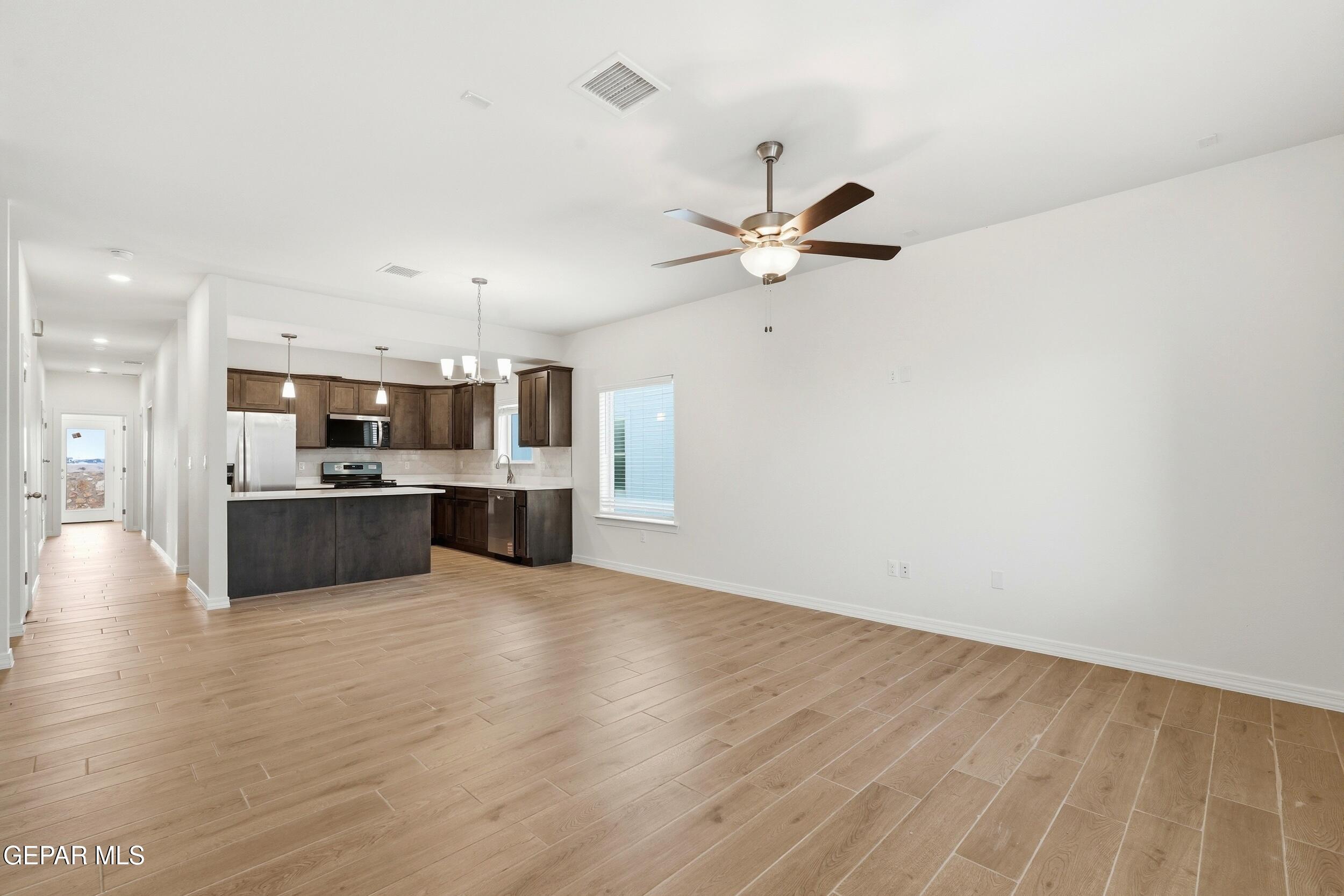 3764 Model Lane El Paso, TX 79938 - Photo 4 of 20 a view of kitchen with wooden floor