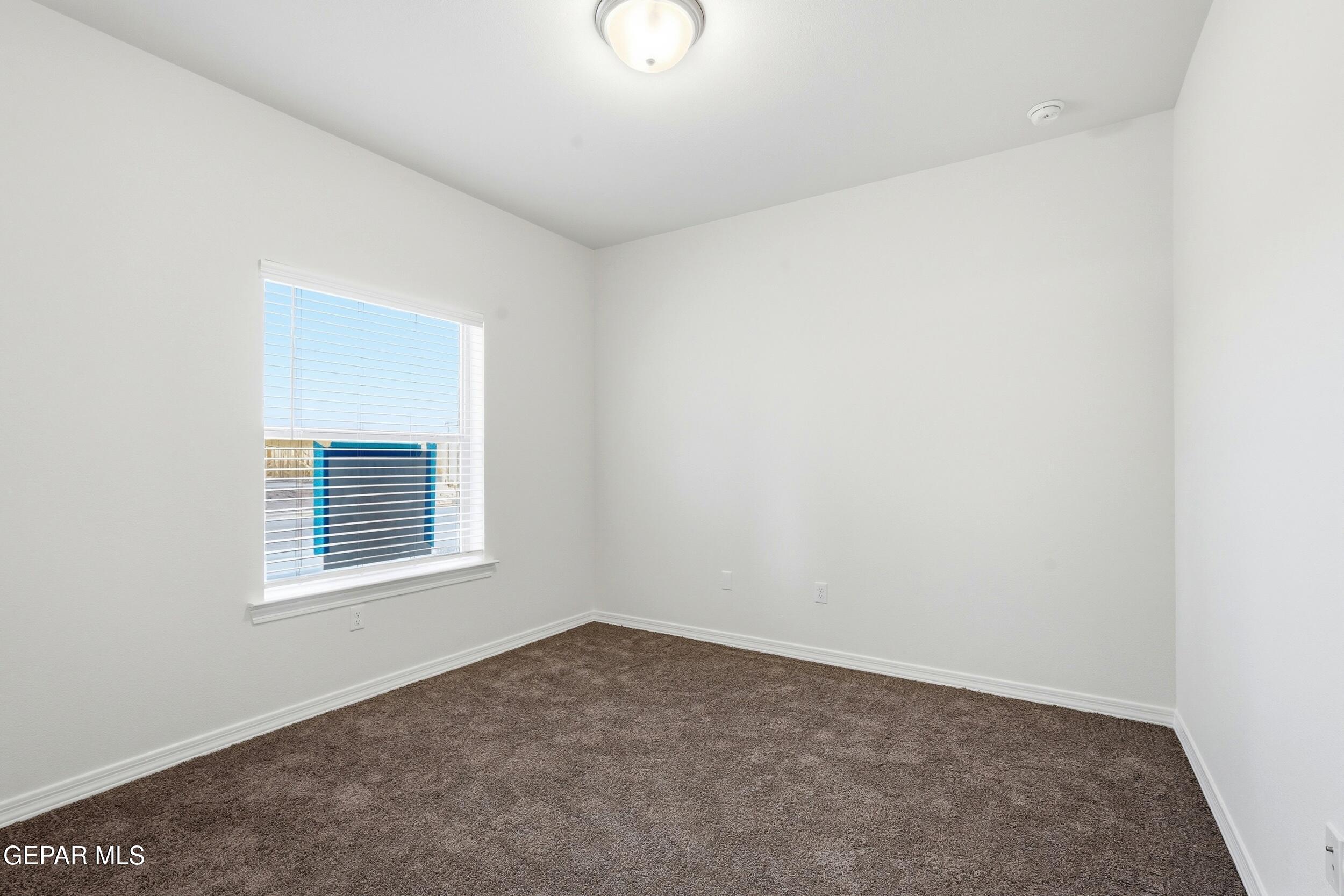 3764 Model Lane El Paso, TX 79938 - Photo 10 of 20 a view of a room that has a window in it