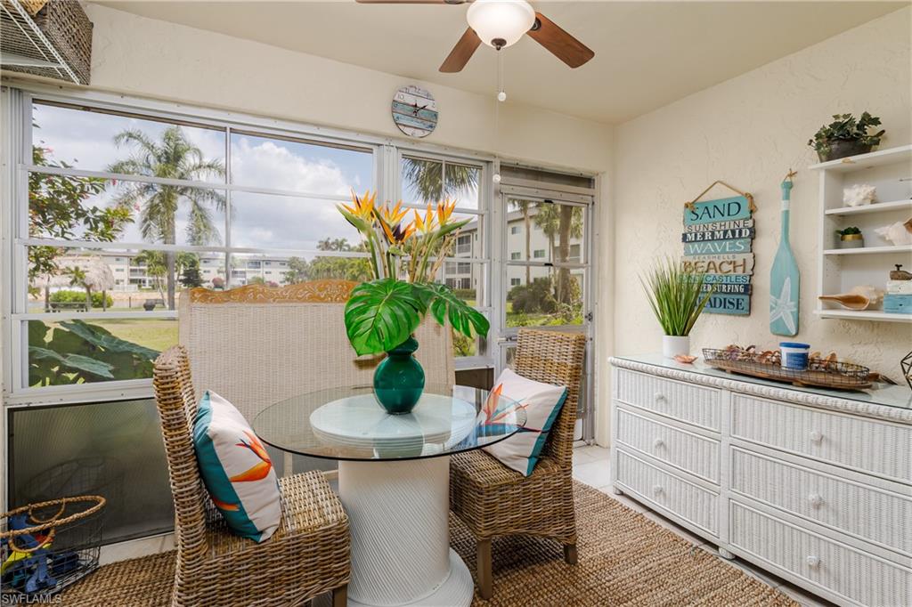 1014 Manatee Road, Unit F102 Naples, FL 34114 - Photo 12 of 36 a dining room with furniture and window