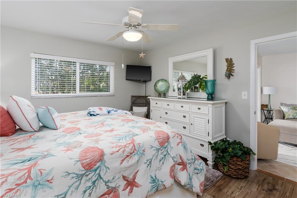 1014 Manatee Road, Unit F102 Naples, FL 34114 - Photo 15 of 36 a bedroom with a large bed and a window