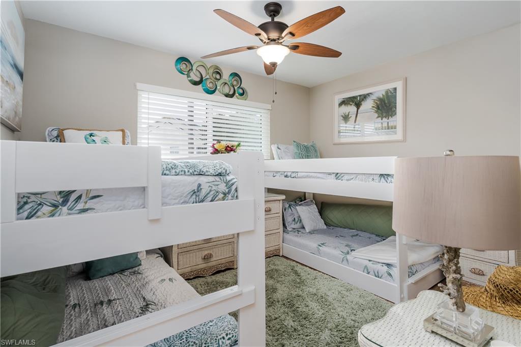 1014 Manatee Road, Unit F102 Naples, FL 34114 - Photo 17 of 36 a living room with furniture and a window