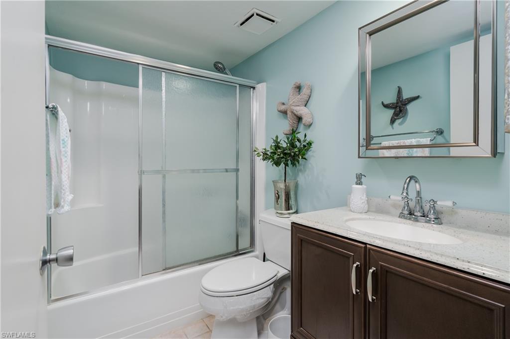 1014 Manatee Road, Unit F102 Naples, FL 34114 - Photo 19 of 36 a bathroom with a sink toilet and shower