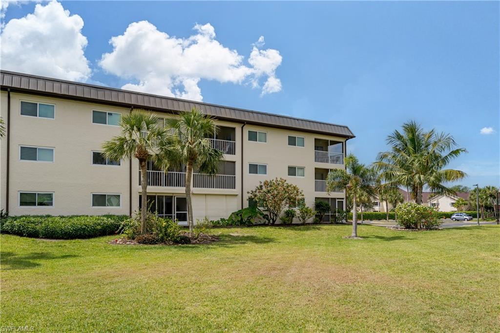 1014 Manatee Road, Unit F102 Naples, FL 34114 - Photo 21 of 36 a front view of a house with garden