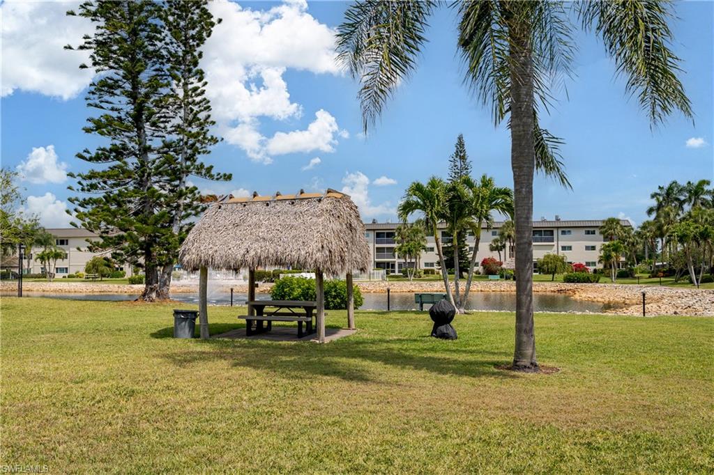 1014 Manatee Road, Unit F102 Naples, FL 34114 - Photo 23 of 36 a house with garden in front of it