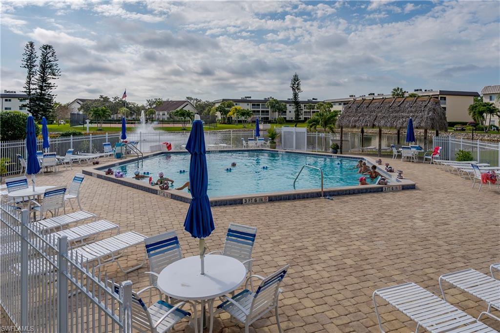 1014 Manatee Road, Unit F102 Naples, FL 34114 - Photo 24 of 36 a view of a terrace with sitting area