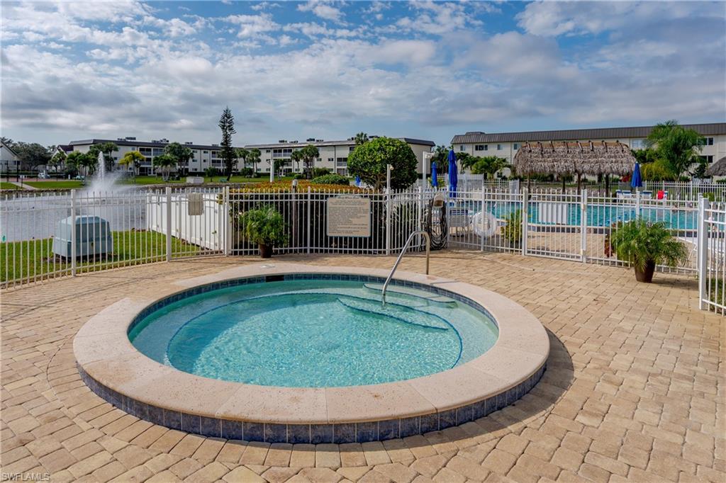 1014 Manatee Road, Unit F102 Naples, FL 34114 - Photo 25 of 36 a view of a swimming pool with a patio
