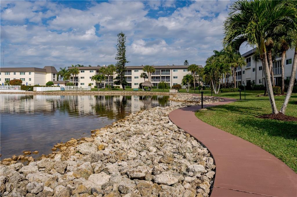 1014 Manatee Road, Unit F102 Naples, FL 34114 - Photo 32 of 36 a view of a lake with a house