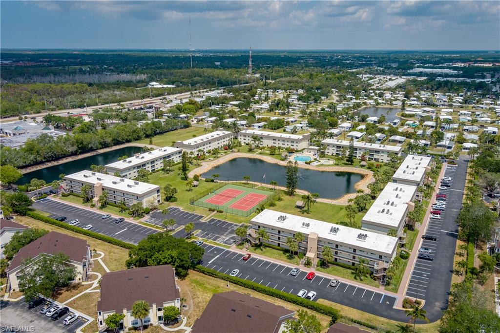 1014 Manatee Road, Unit F102 Naples, FL 34114 - Photo 35 of 36 an aerial view of residential building and lake