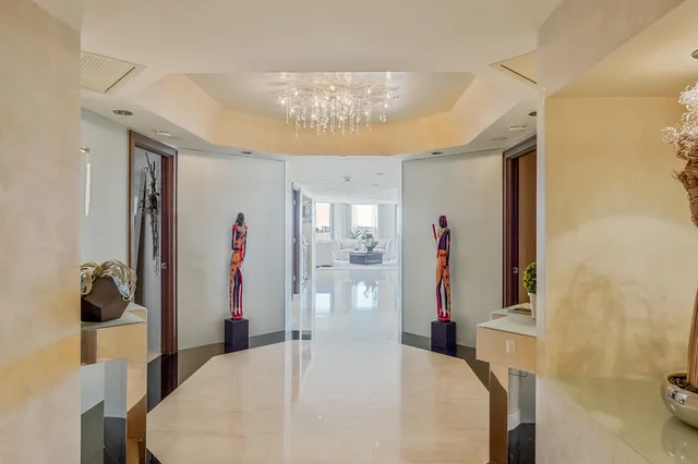 a bedroom with a large bed and a large window