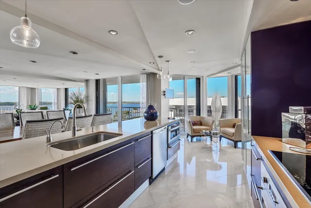 a view of a building with a garden and sitting area