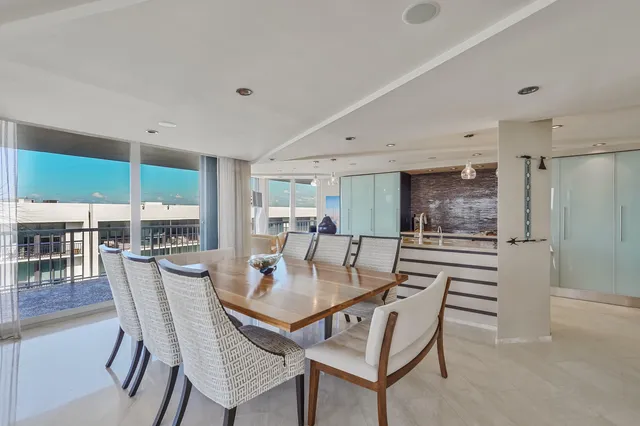 an aerial view of a house with a garden and lake view