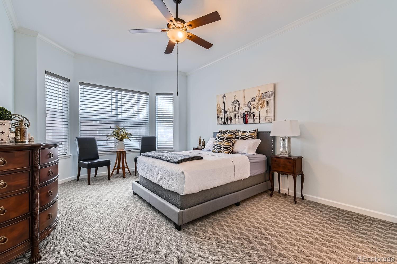 4500 Silver Mountain Loop Broomfield, CO 80023 - Photo 15 of 37 a spacious bedroom with a bed and a table in it