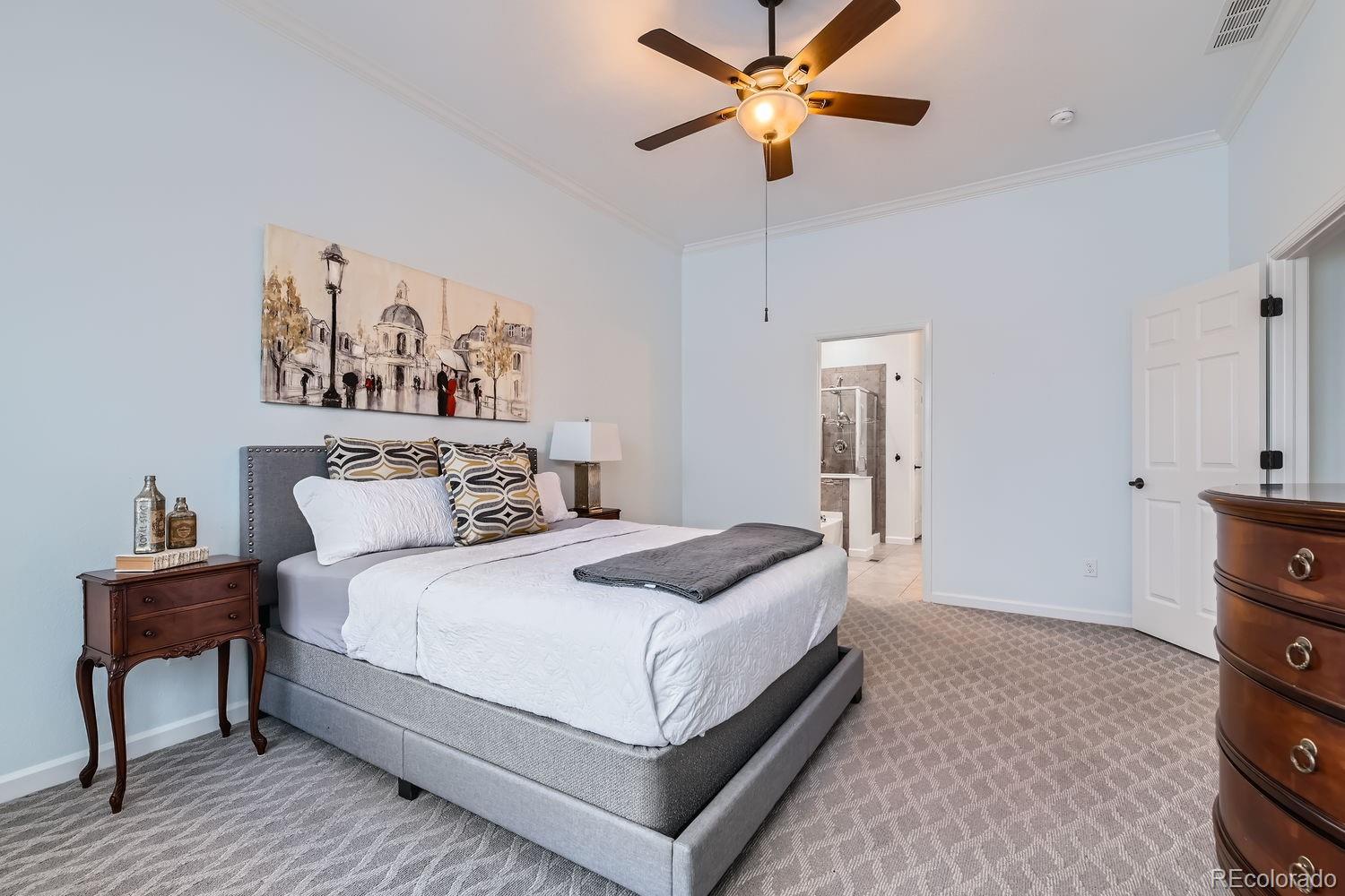 4500 Silver Mountain Loop Broomfield, CO 80023 - Photo 17 of 37 a bedroom with a bed and a chandelier
