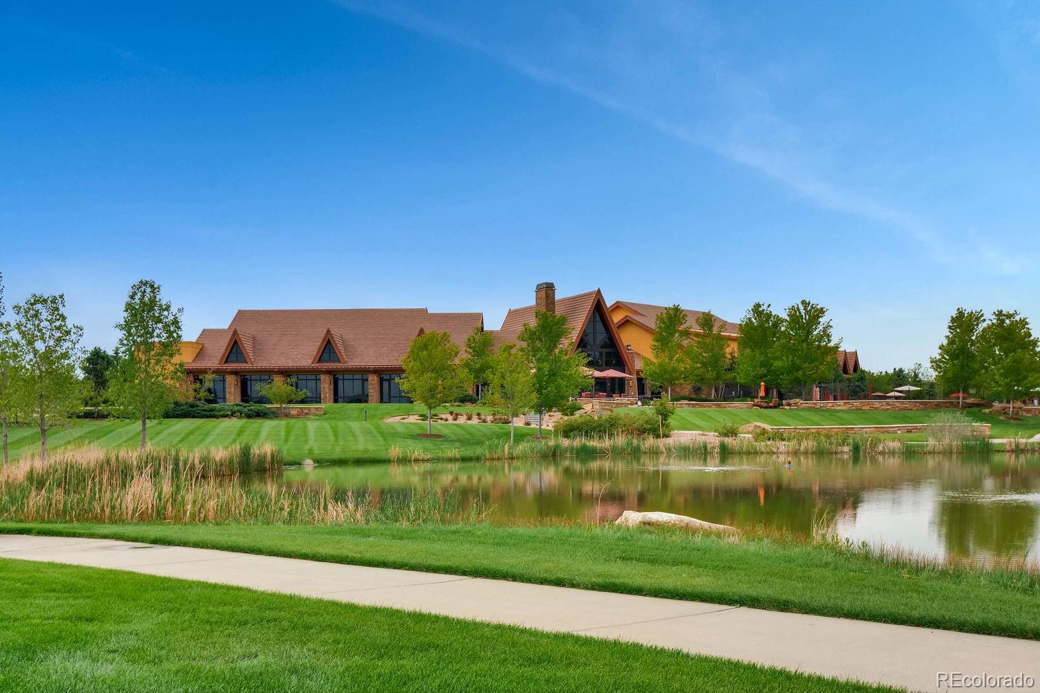 4500 Silver Mountain Loop Broomfield, CO 80023 - Photo 29 of 37 a view of a lake with houses in the back