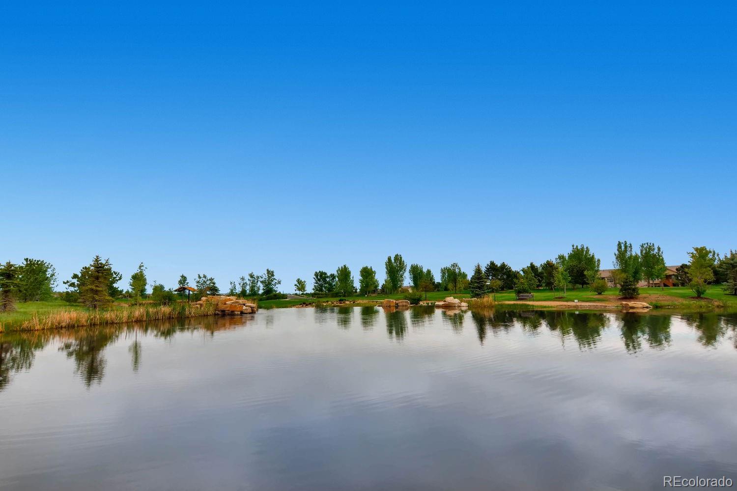 4500 Silver Mountain Loop Broomfield, CO 80023 - Photo 35 of 37 a view of a lake with houses in background