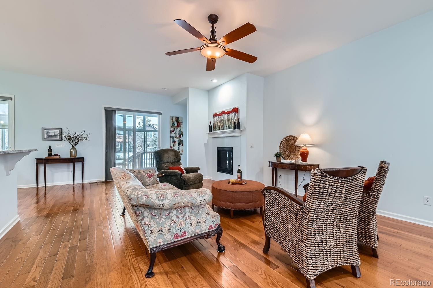 4500 Silver Mountain Loop Broomfield, CO 80023 - Photo 5 of 37 a living room with furniture and a wooden floor