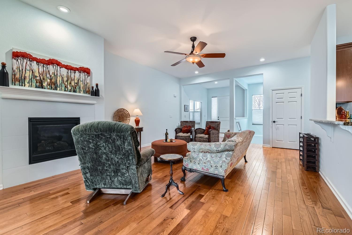 4500 Silver Mountain Loop Broomfield, CO 80023 - Photo 6 of 37 a living room with furniture and a wooden floor