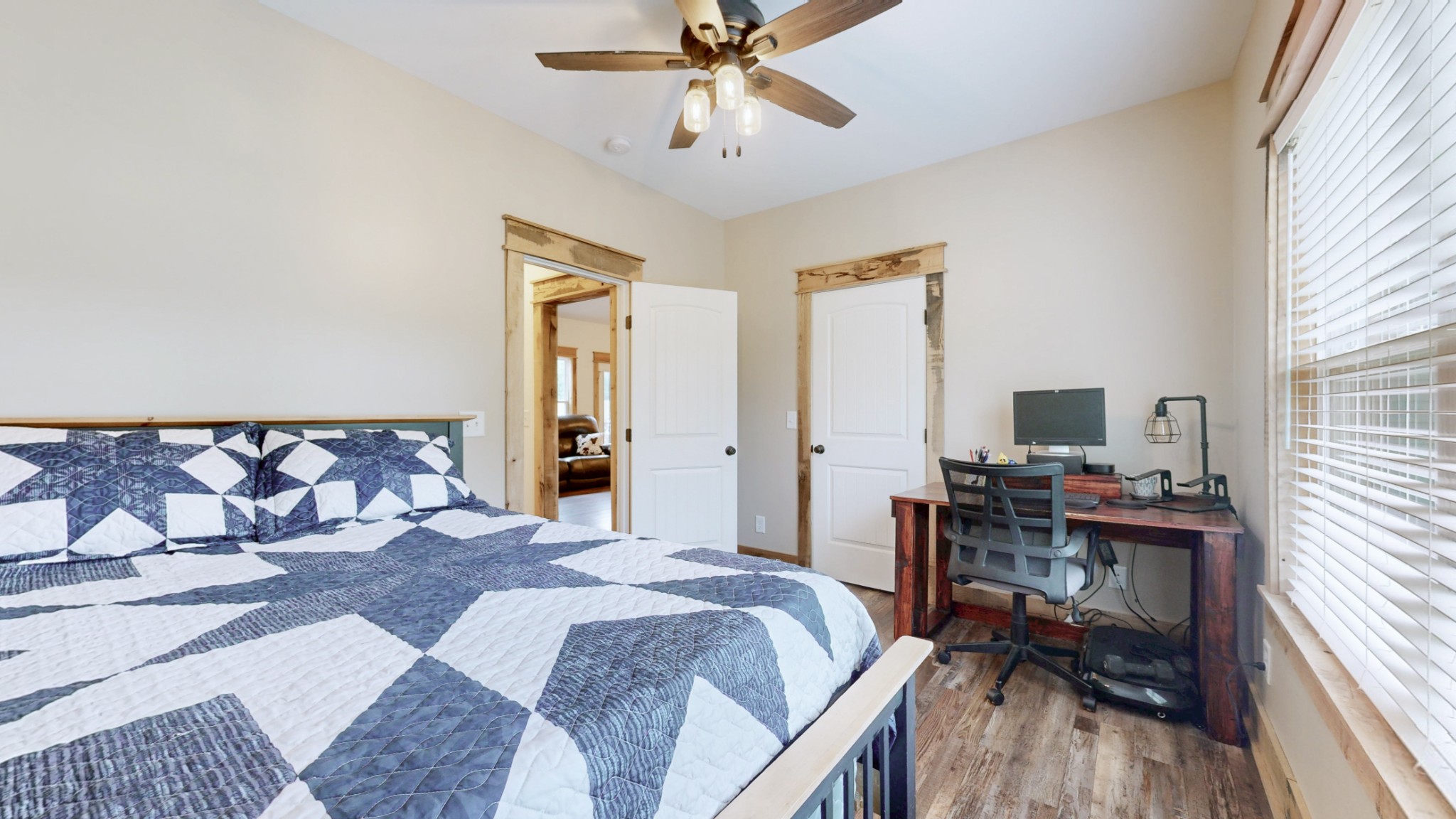 601 King Ridge Road Dowelltown, TN 37059 - Photo 28 of 49 a bedroom with a bed and a chandelier