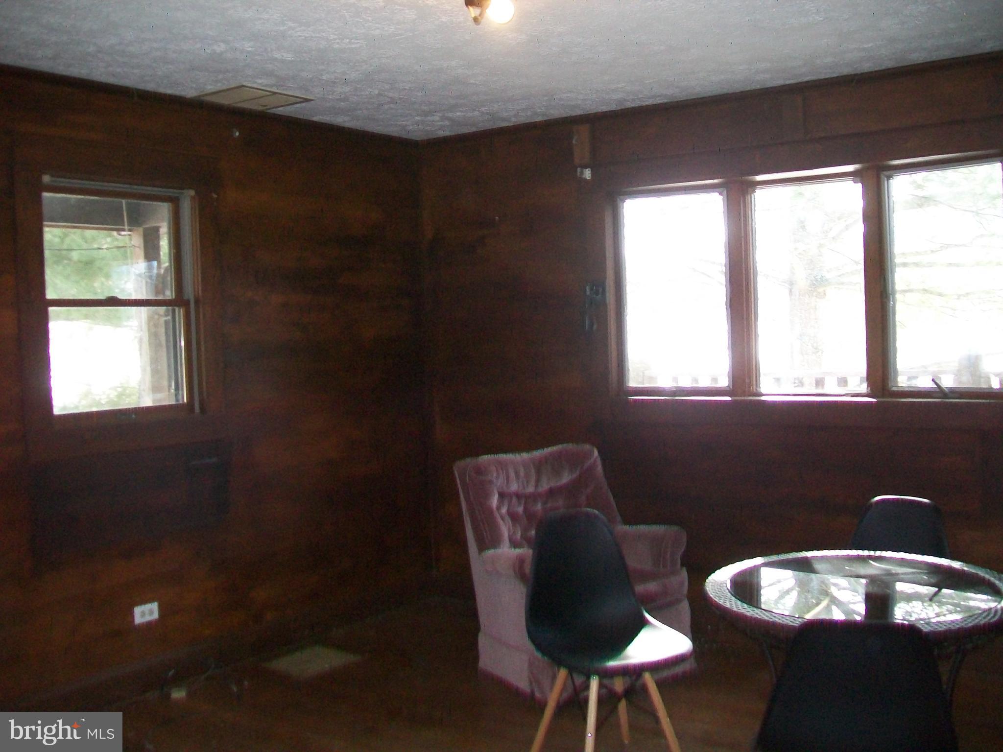 5621 Kiser Gap Road Upper Tract, WV 26866 - Photo 17 of 54 a view of a dining room with furniture and window