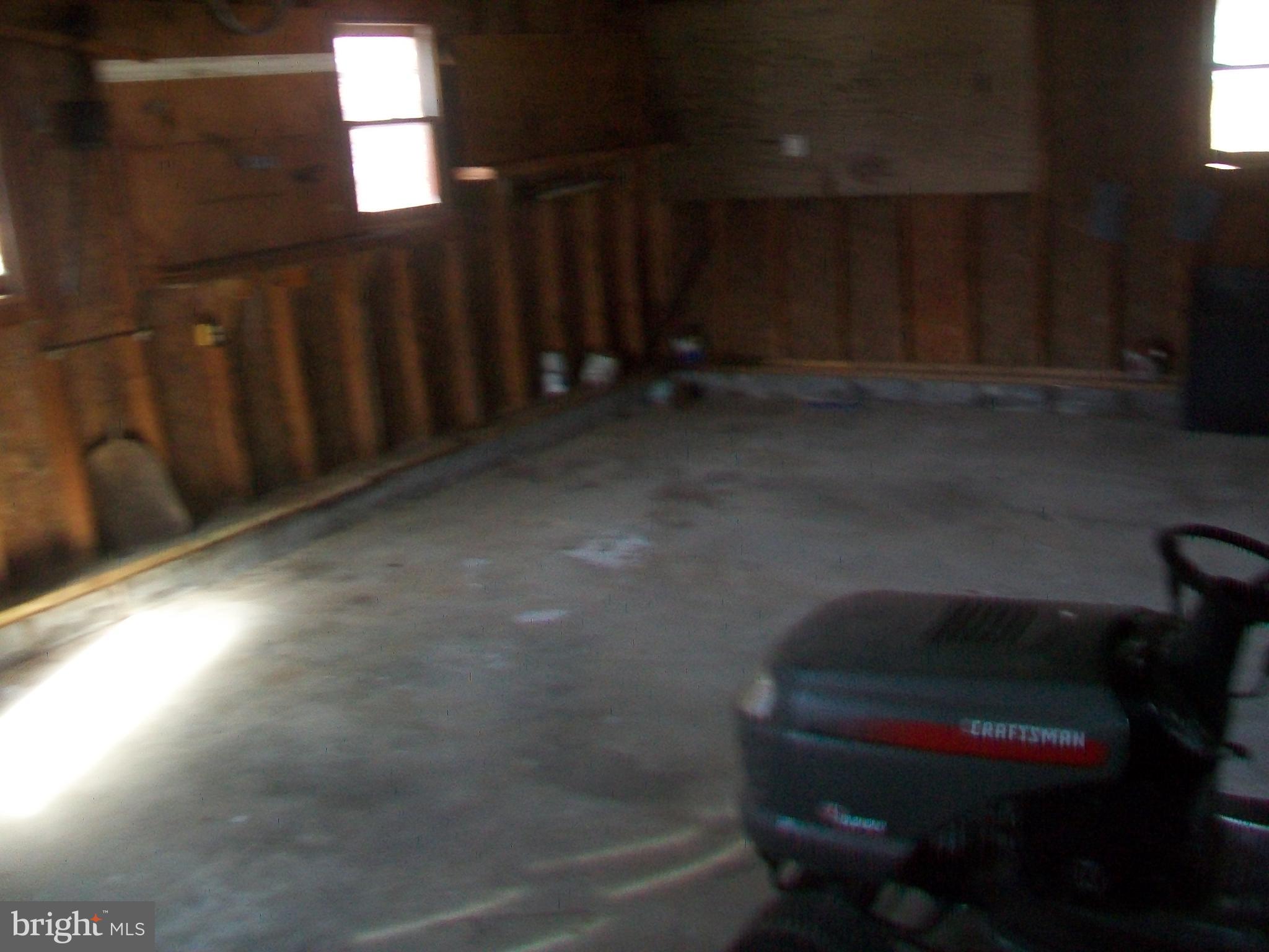5621 Kiser Gap Road Upper Tract, WV 26866 - Photo 42 of 54 a room with a chair and wooden floor