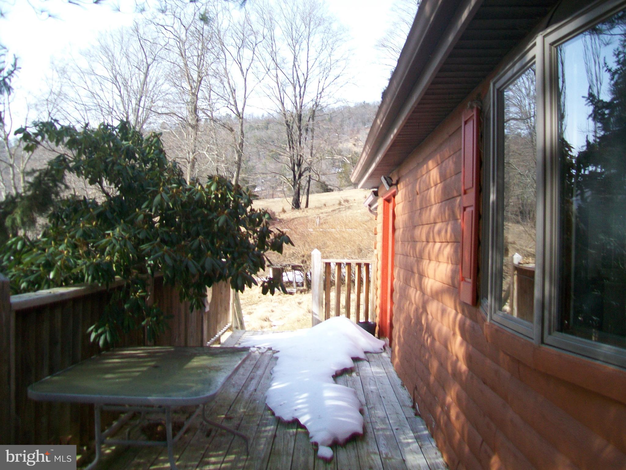 5621 Kiser Gap Road Upper Tract, WV 26866 - Photo 44 of 54 a view of a porch with furniture and a yard