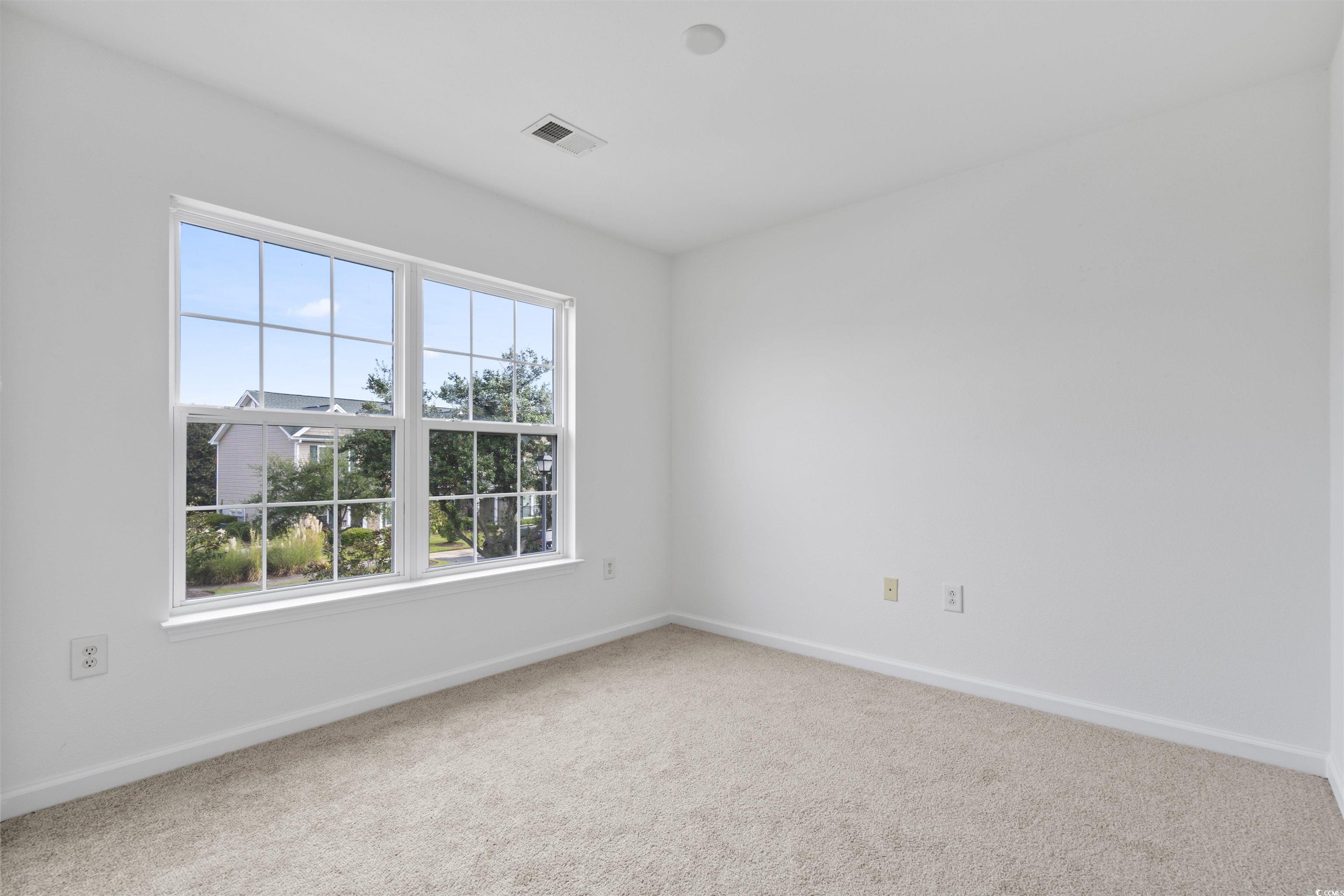160 Chenoa Drive, Unit A Murrells Inlet, SC 29576 - Photo 26 of 37 Empty room featuring light colored carpet and baseboards
