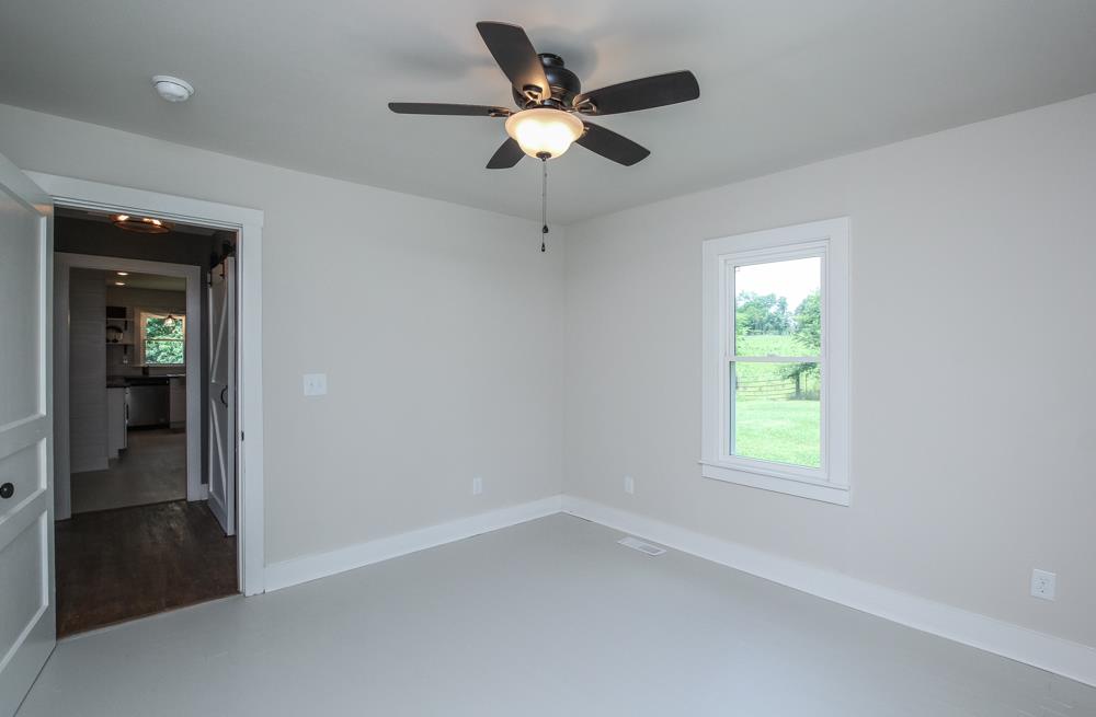 950 Owens Road Watertown, TN 37184 - Photo 14 of 30 wooden floor in an empty room with a window