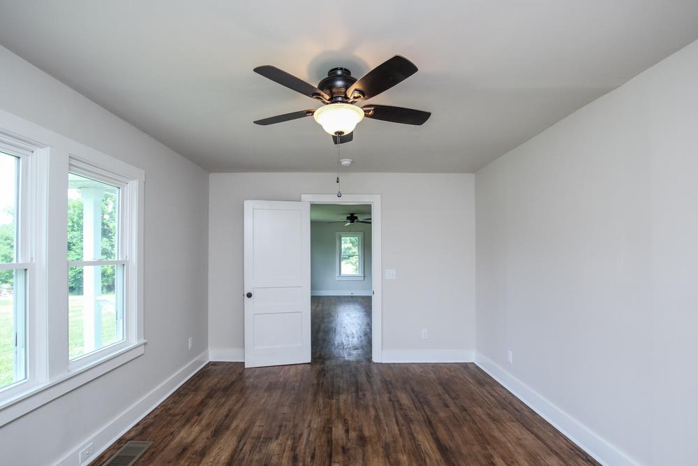 950 Owens Road Watertown, TN 37184 - Photo 16 of 30 a view of empty room with wooden floor and fan