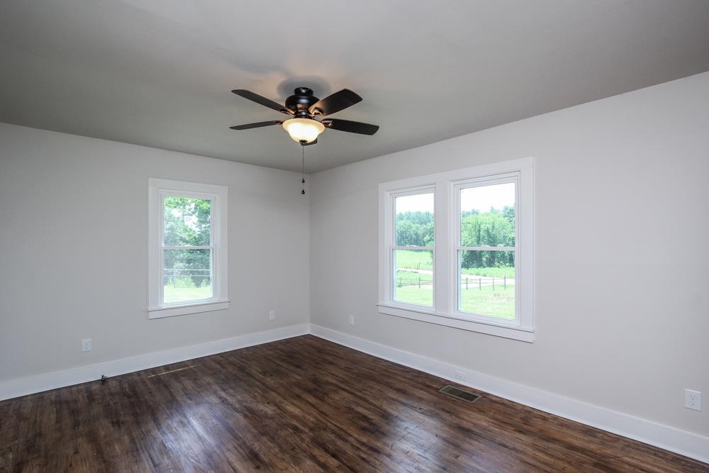 950 Owens Road Watertown, TN 37184 - Photo 17 of 30 a view of an empty room with wooden floor and a window