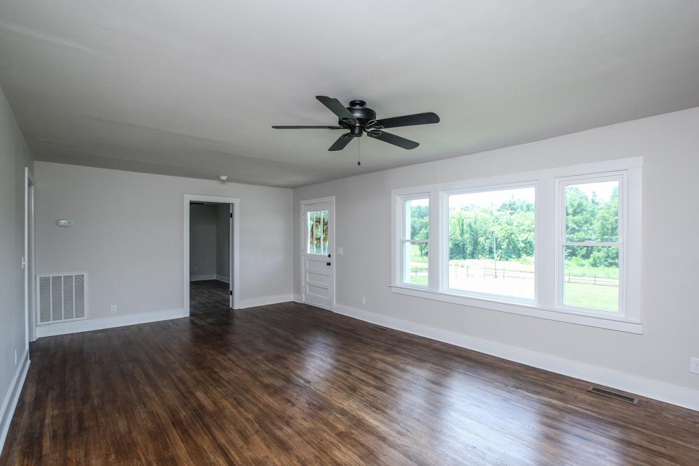 950 Owens Road Watertown, TN 37184 - Photo 20 of 30 a view of a livingroom with a ceiling fan and window