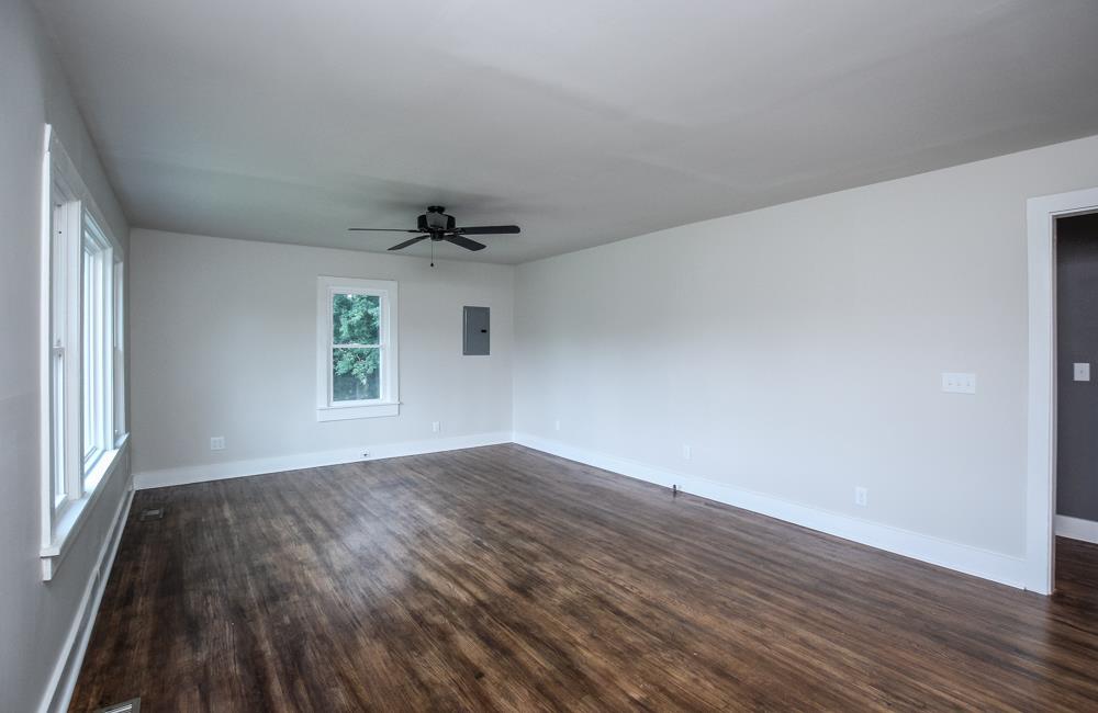 950 Owens Road Watertown, TN 37184 - Photo 21 of 30 an empty room with wooden floor and windows