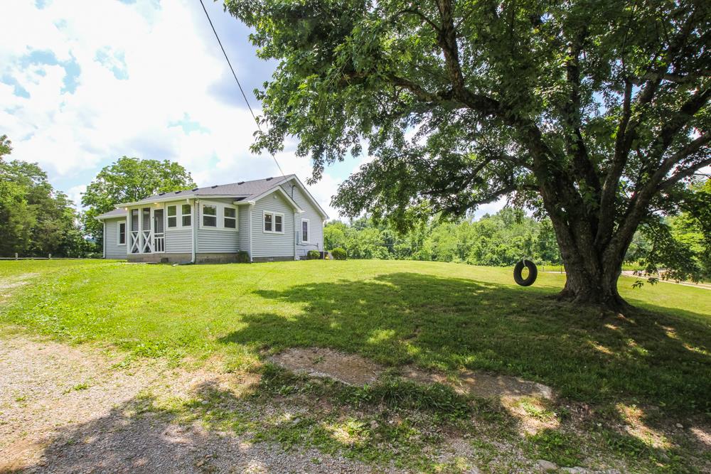 950 Owens Road Watertown, TN 37184 - Photo 27 of 30 a view of house with garden space and trees