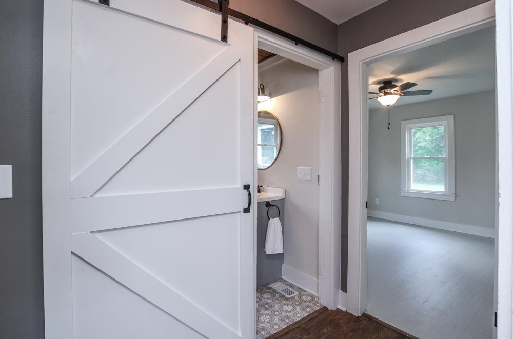 950 Owens Road Watertown, TN 37184 - Photo 10 of 30 a view of a hallway with a white walls and stairs