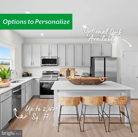 a kitchen with a table chairs sink and cabinets