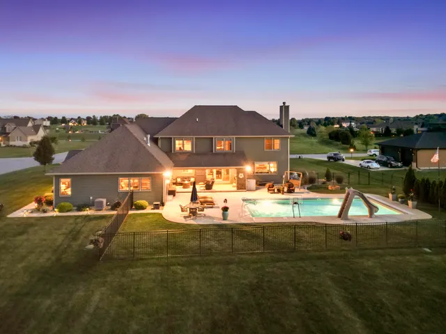 a bedroom with a large bed and a tv