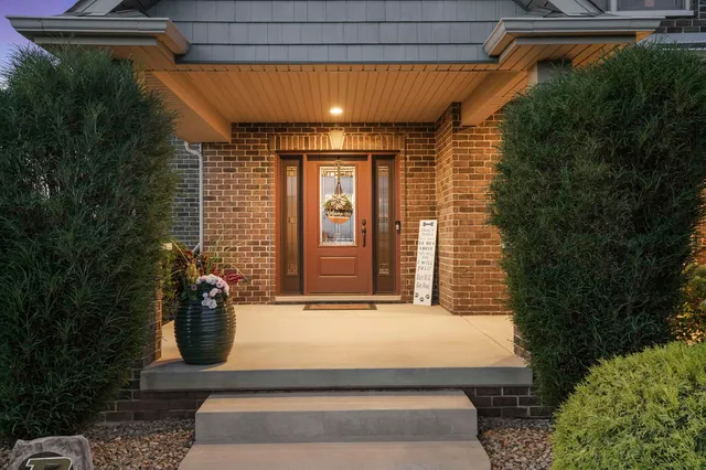 an aerial view of a house with a swimming pool