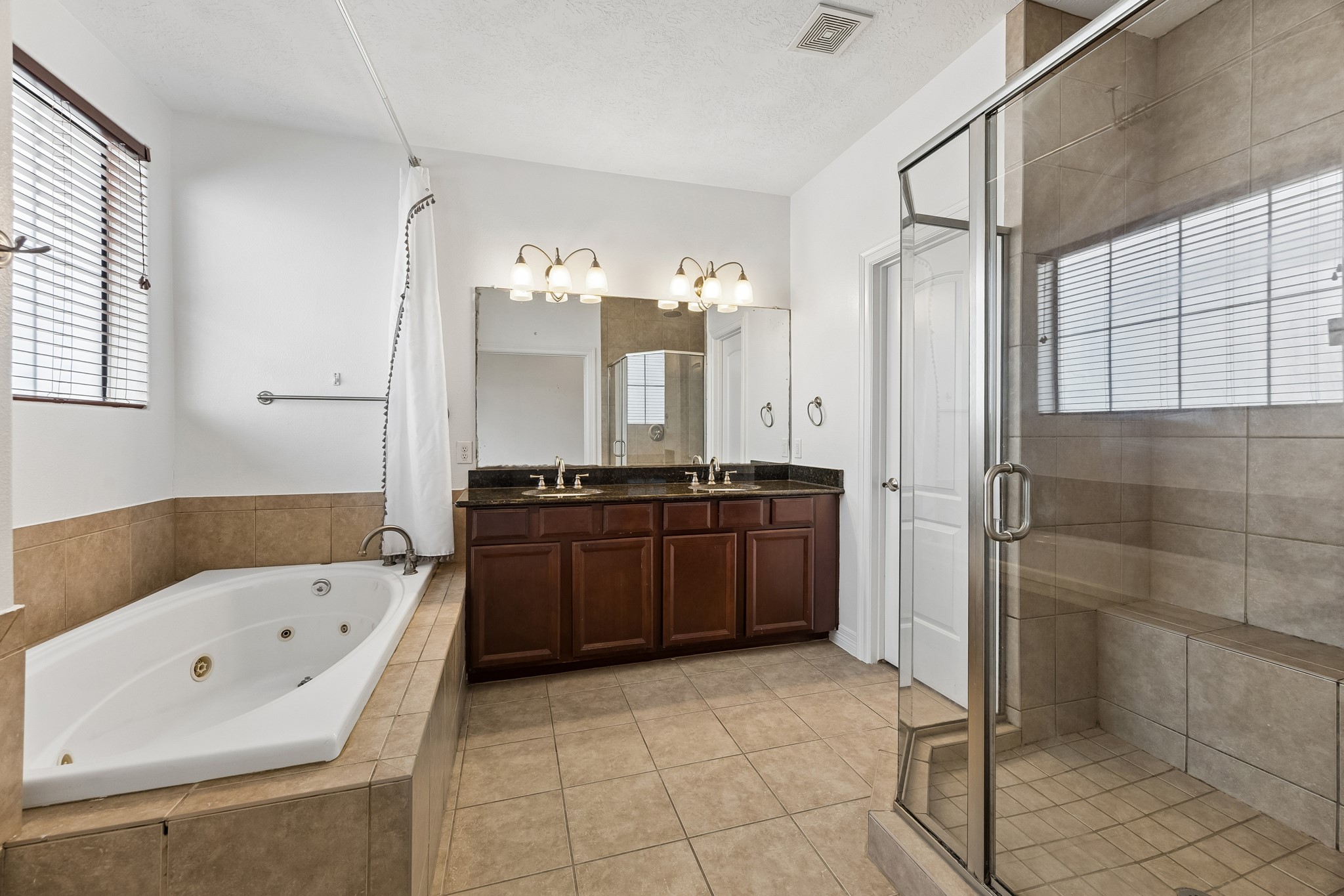 4102 Bonner View Lane Houston, TX 77007 - Photo 13 of 14 a large bathroom with a tub a sink and glass windows